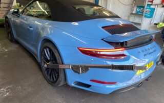 Blue Porsche 991 GTS with centre lock wheels in for PADM fault diagnosis