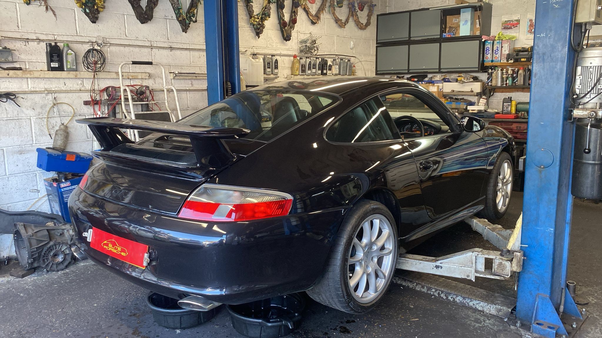 Porsche 911 4S in the workshop for front driveshaft boot repair