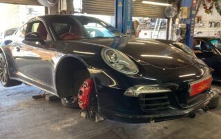 Porsche 911 4S in the workshop for front driveshaft boot repair