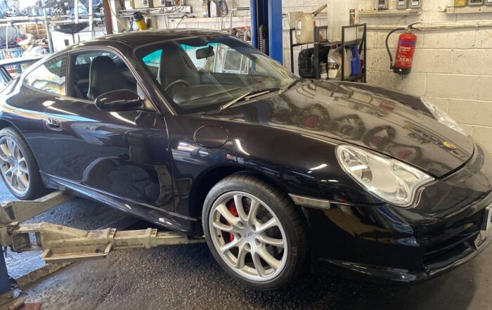 Porsche 911 4S in the workshop for front driveshaft boot repair