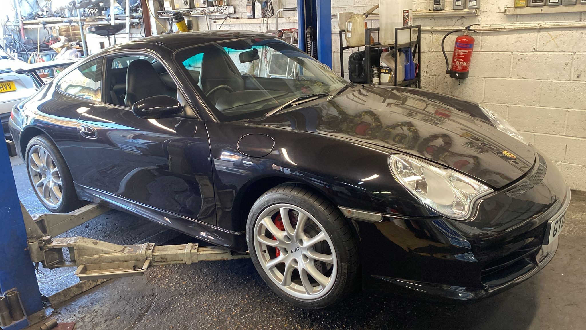 Porsche 911 4S in the workshop for front driveshaft boot repair