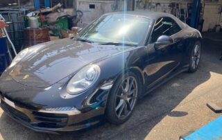 Black Porsche 991 in for air conditioning service and interior odour treatment
