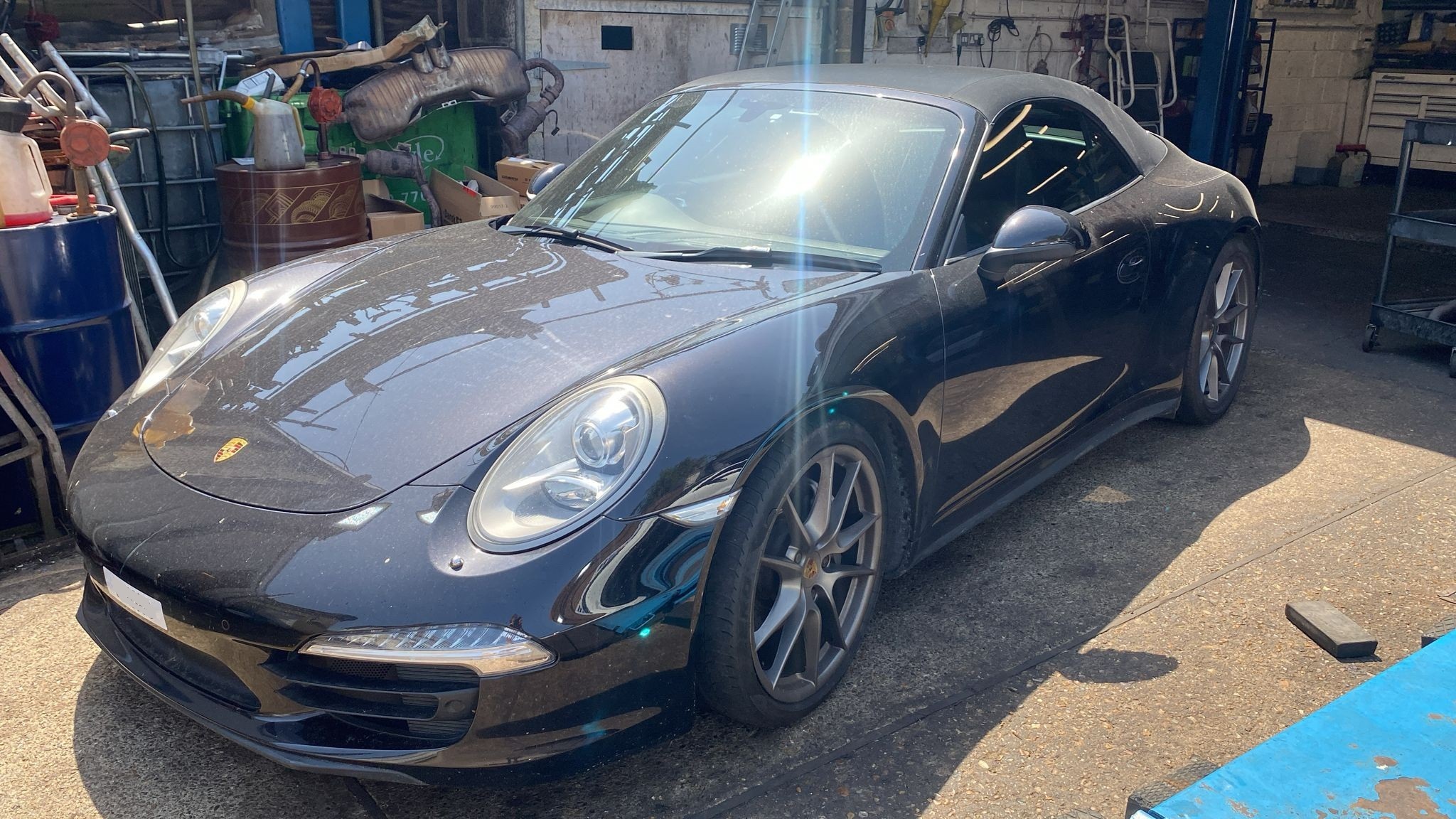 Black Porsche 991 in for air conditioning service and interior odour treatment